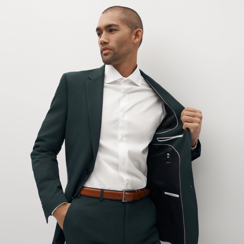 man in a dark green suit